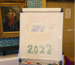 A flip chart saying Happy New Year 2022