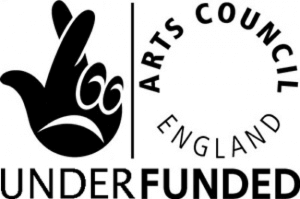A parody of the National Lottery and Arts Council England logo. The words "Lottery Funded" have been replaced with "Under Funded"